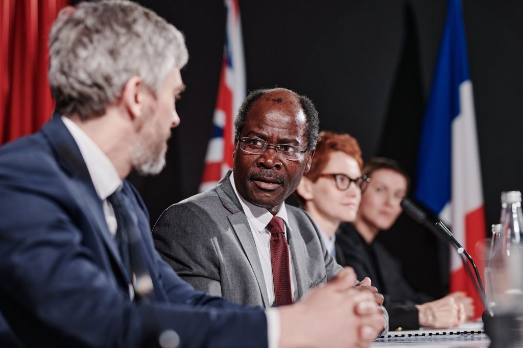 Political colleagues discussing at meeting